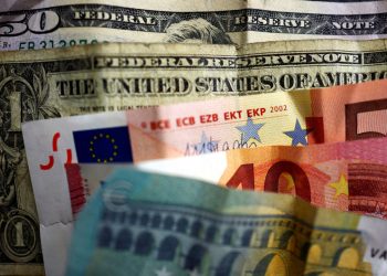 Dollar gains on tariffs fears; euro looks to ECB meeting